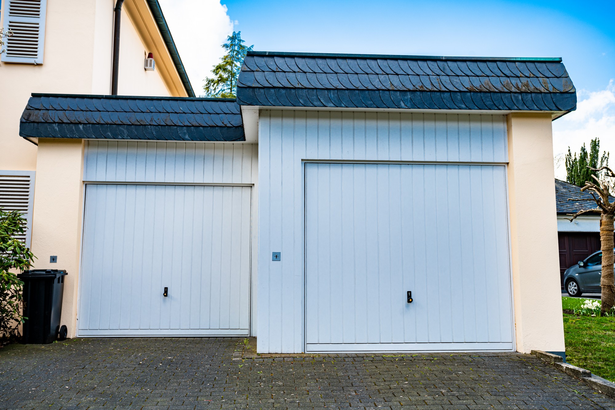 Wide Garage Door And Concrete Driveway In Front 2021 09 02 07 53 05 Utc