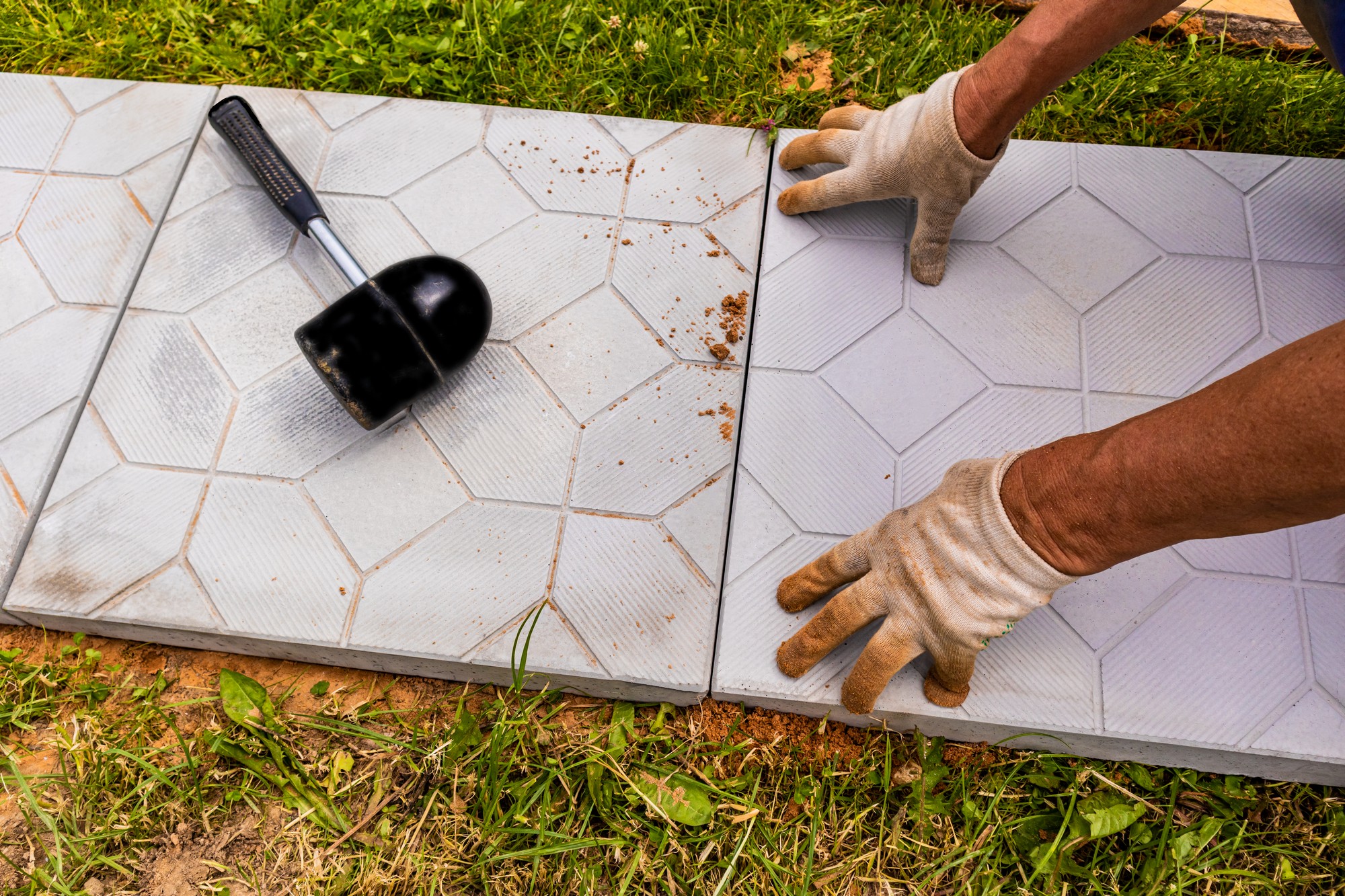 The Hands Of A Worker In Gloves Lay Tiles In A Cou 2022 10 27 23 48 39 Utc